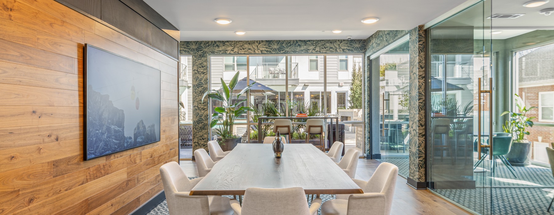 table with chairs and large windows